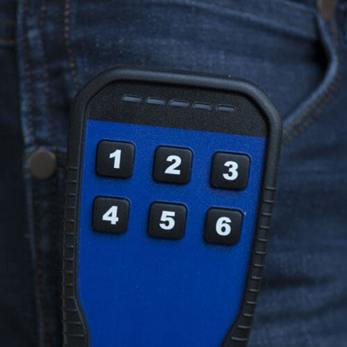 pocket transmitter radio remote control with six buttons on jeans pocket